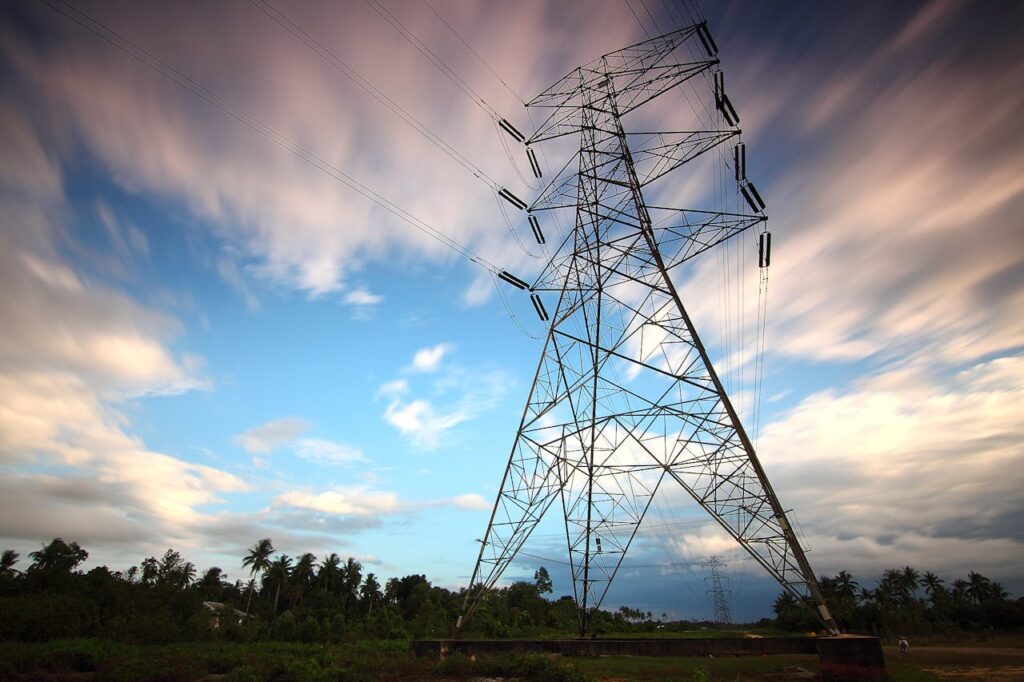 pexels-photo-157827 Stunning view of a towering power line against a vibrant sky, showcasing energy infrastructure in nature.